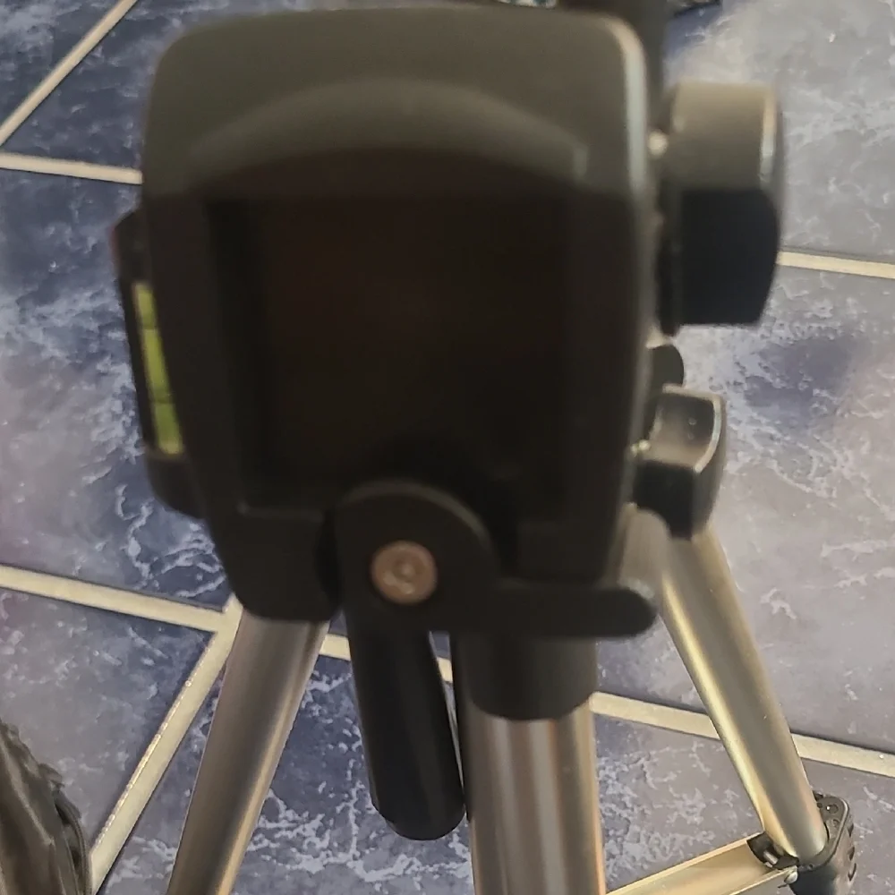 Versatile Black and Silver Camera Tripod